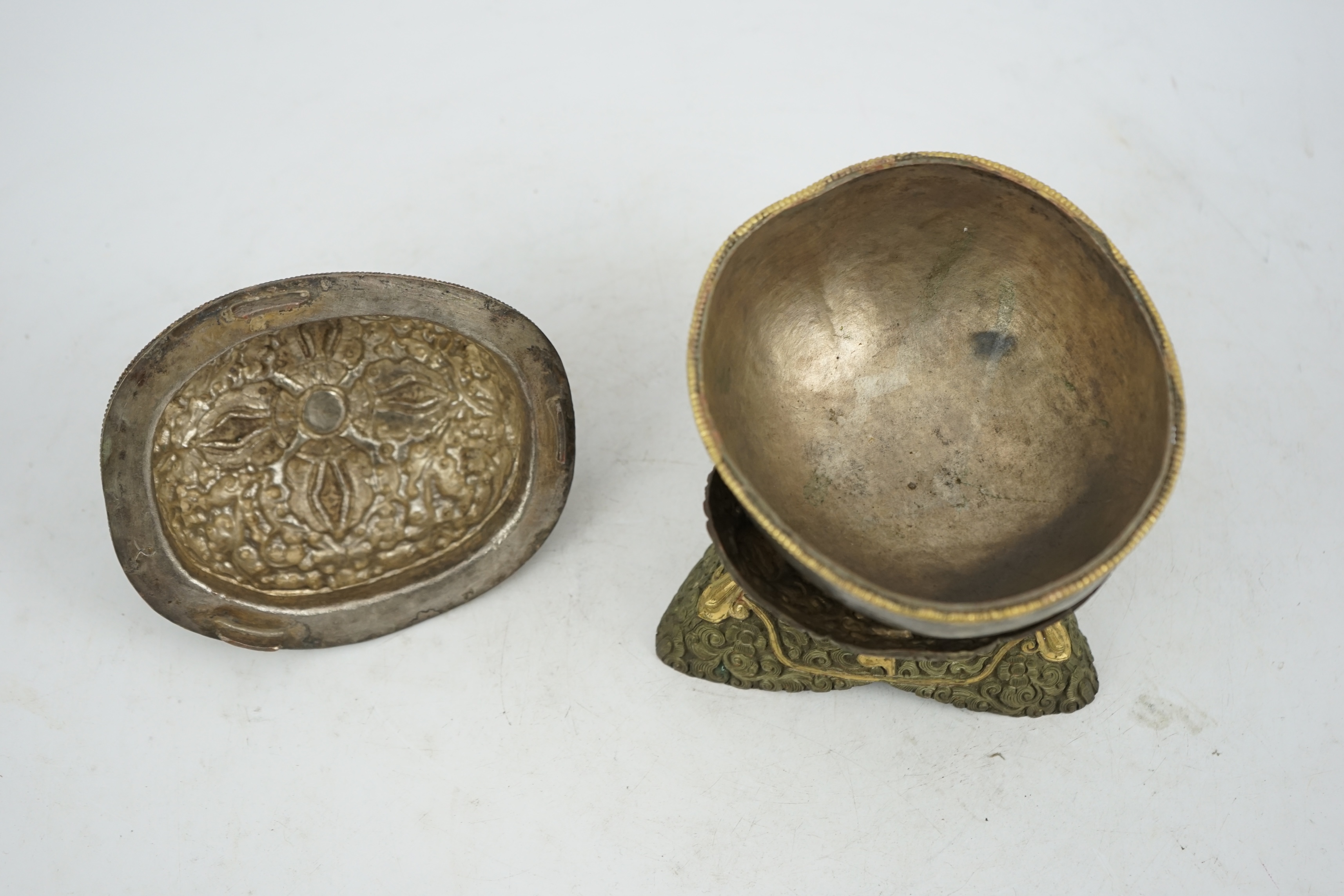 A Tibetan silvered and gilt repoussé copper and bronze capala bowl, late 19th/early 20th century